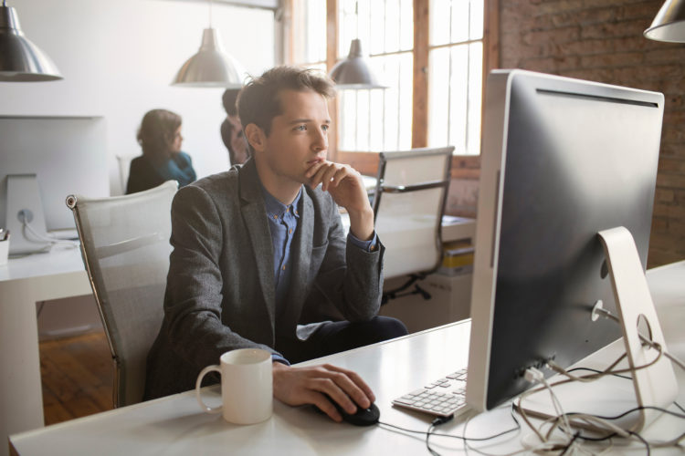 Young professional looking at computer