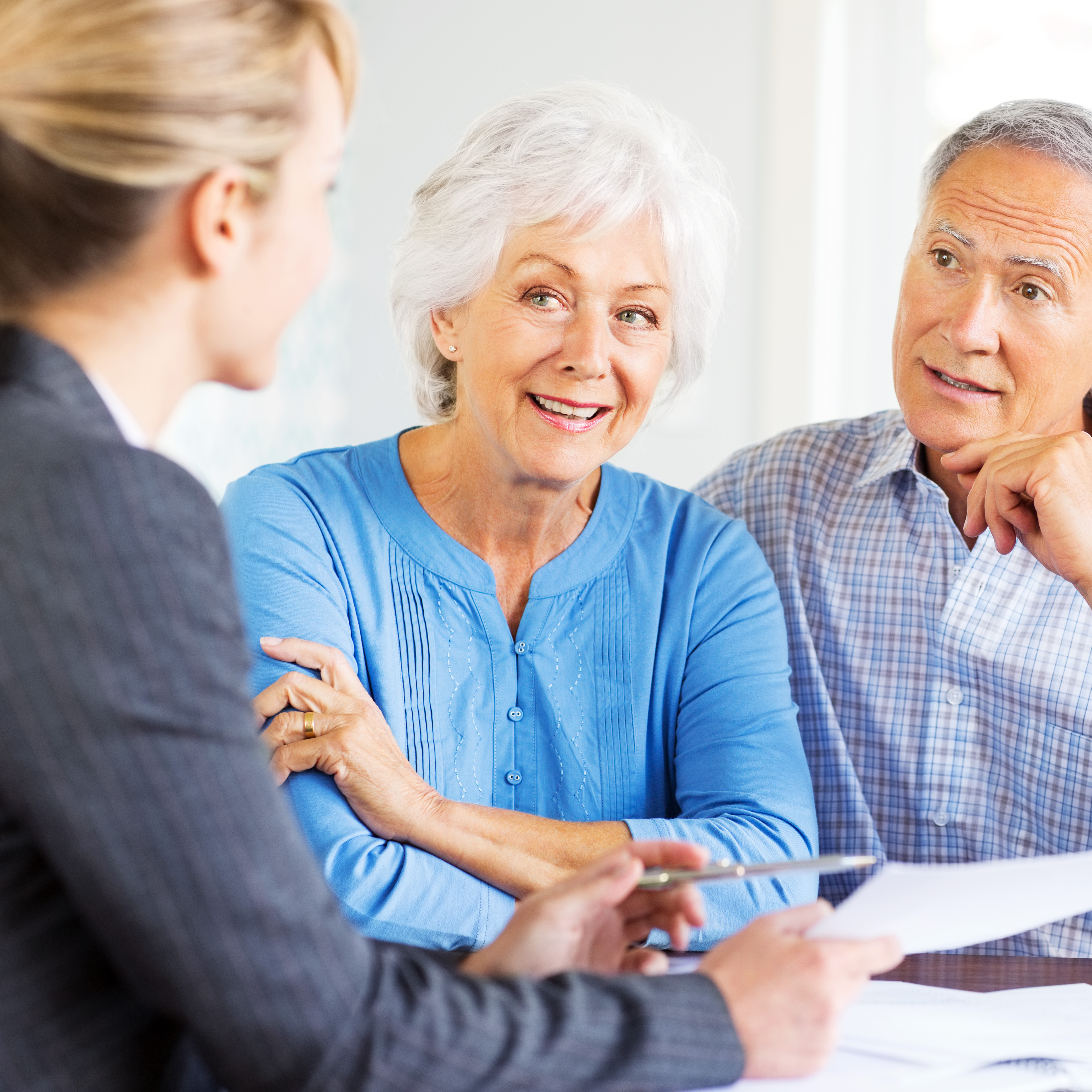 Senior Couple With Financial Advisor At Home Bank Of Marin